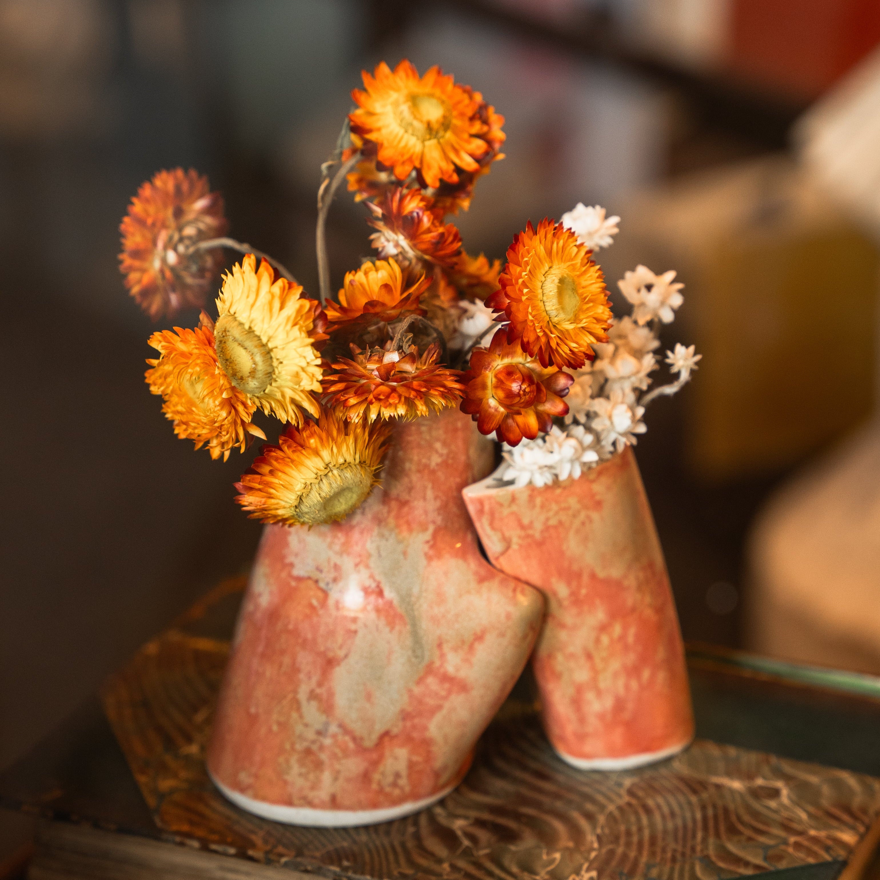 Embrace Vase from Margaret Stickler's LeanOnMe collection photographed by Brayan Mesa on display at the Harvard COOP in Cambridge, MA.