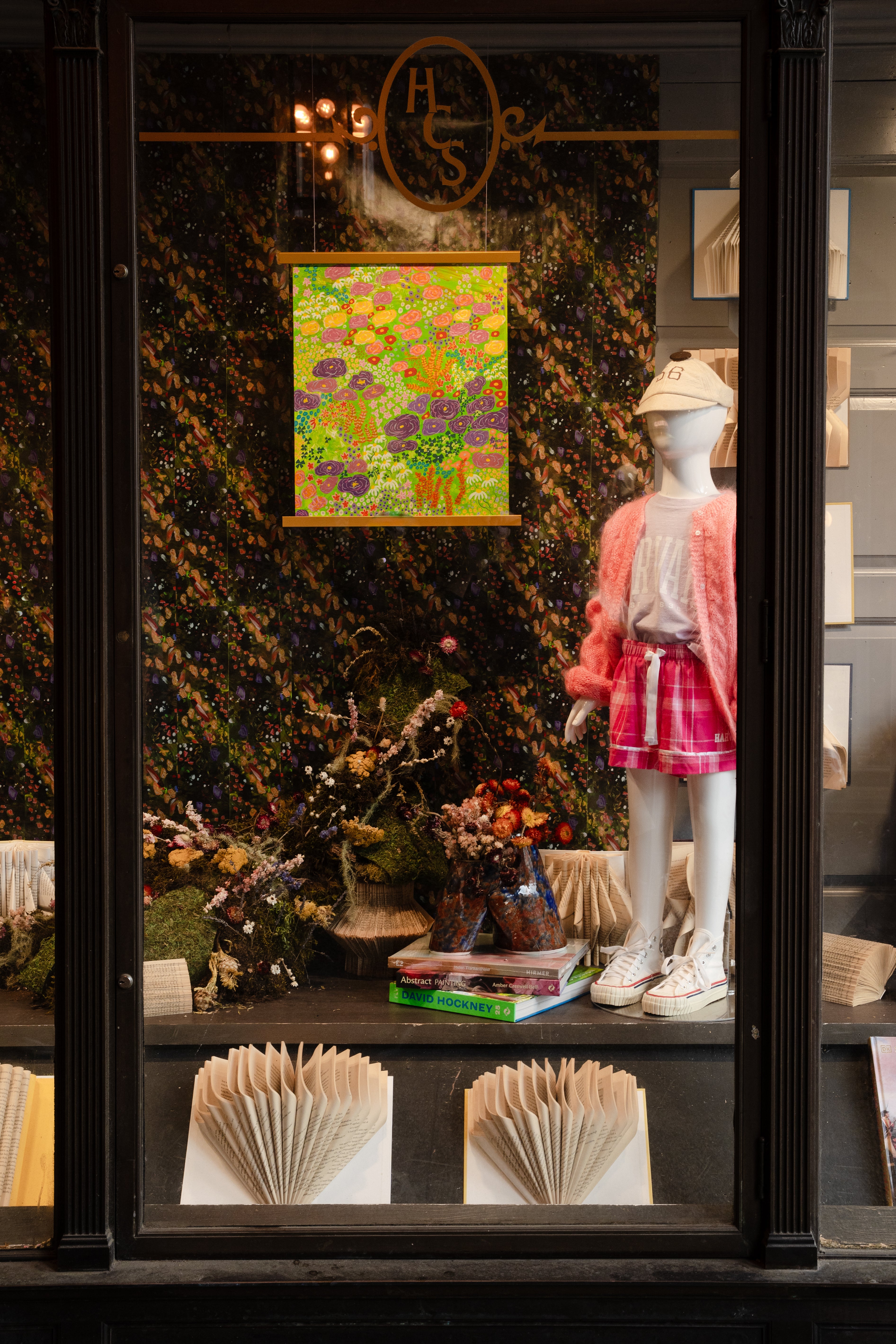 "Neon FLoral Meadow" abstract painting by Pollen Price (@BostonPollen) hanging in the Harvard Coop window display of "For Love of Nature and Literature"